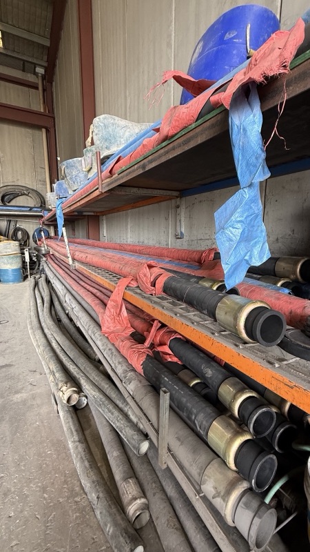 Lengths of delivery pipe stacked in the yard