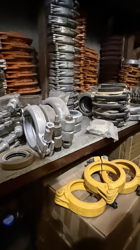 Clamps, gaskets and yellow hose ends on the parts shelf